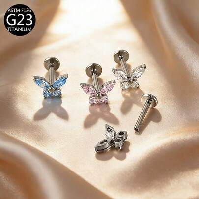 1 chiếc khuyên tai ren trong bằng titan G23 cỡ 1.0/1.2, đính đá Zirconia hình bướm, nhiều màu sắc, phù hợp cho nữ giới đeo hàng ngày.