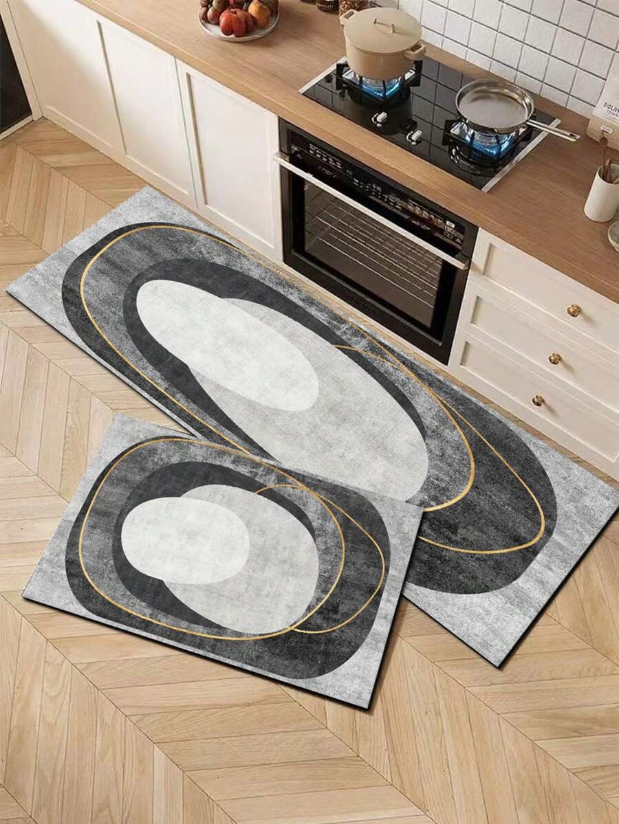 1 tấm thảm bếp cao cấp hiện đại, họa tiết hình học trừu tượng, làm từ gel silica, với các khối hình elip màu xám và trắng bất đối xứng làm nền, được tô điểm bởi các đường cong vàng mềm mại, tạo hiệu ứng thị giác tối giản, thanh lịch và nhiều lớp. Thảm bếp thời trang cao cấp, thảm chống mỏi chân, chất liệu vải bề mặt, lớp xốp thấm hút ở giữa. - Nhiều màu - Xem 1