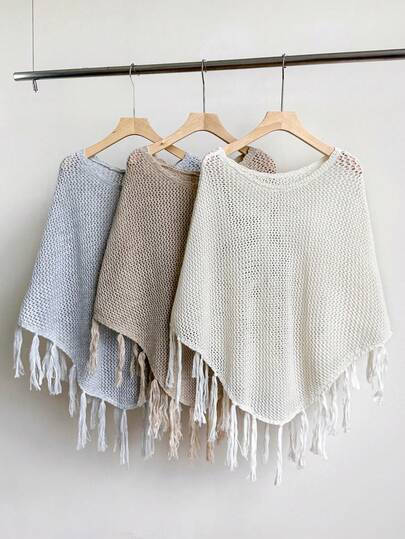 1件女士纯色针织镂空流苏披肩，羊毛混纺材质，防晒、装饰、透气，优雅休闲，适合海滩/空调房穿着，春、夏、秋、冬四季皆宜。