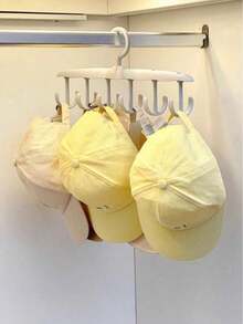 1个12钩旋转衣架，节省空间，可悬挂晾晒内衣，多功能衣架，适用于衣柜收纳。12钩旋转设计，带铰链，采用耐用轻便塑料材质，最大限度地利用小型衣柜空间，可整齐收纳胸罩、内裤、袜子和配饰，是宿舍、公寓、小房间的理想之选。安装简便，快速晾干，现代简约风格，时尚实用，是衣柜收纳神器。经久耐用，适合日常使用，是紧凑型家居的便捷解决方案，也是春季大扫除和换季整理的完美礼物，是忙碌家庭的衣柜收纳利器。 - 彩色 - 查看 7