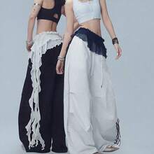 1 chiếc váy ngắn xòe xếp tầng có thắt lưng và tua rua, thích hợp cho các buổi khiêu vũ đường phố, hộp đêm, vũ trường, lễ hội, tiệc tùng và các dịp biểu diễn khác. Váy trang trí tua rua đa năng. - Nhiều màu - Xem 3