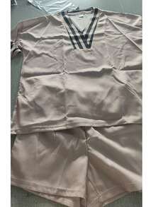 A Relaxed Two-Piece Summer Outfit For Women In A French Style – Featuring A Greek-Inspired V-Neck Top With Wide Sleeves And High-Waisted Shorts, Perfect For Casual Elegance And Comfort At The Beach - Beige - View 6