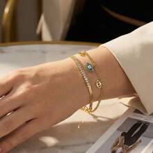 1 chiếc vòng tay nữ bằng thép không gỉ mạ vàng 18K hình mắt ác, phong cách thời trang Âu Mỹ tinh tế, tối giản, đa năng, tạo nên bầu không khí độc đáo. Đeo chiếc vòng tay hình mắt ác này giống như đeo một "bùa may mắn" trên cổ tay. Họa tiết mắt ác cổ điển mang ý nghĩa lãng mạn, và việc bắt gặp chi tiết tinh tế này trong trang phục hàng ngày của bạn sẽ thu hút mọi ánh nhìn. - yếu tố mắt ác - Xem 3