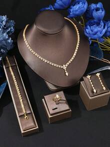 Bộ 5 món trang sức cho bé gái gồm dây chuyền, vòng tay, bông tai và nhẫn, phụ kiện thời trang sang trọng, thanh lịch, phù hợp cho đám cưới và trang trí hàng ngày. - Vàng - Xem 2
