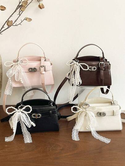 1个女童纯色PU扭扣时尚手提包斜挎包，适合所有季节日常使用，不含吊坠