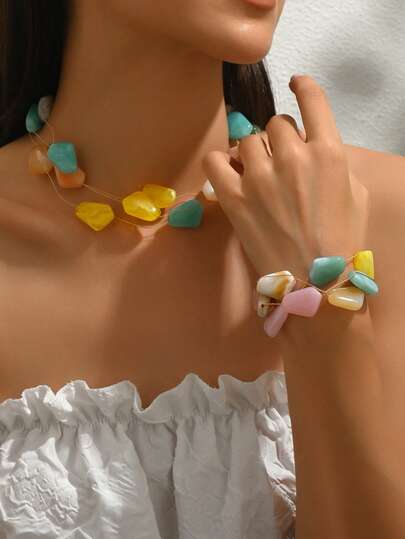 Set de collar y pulsera asimétricos de 2 piezas en colores pastel de macarrón, adecuado para el uso en vacaciones de las mujeres