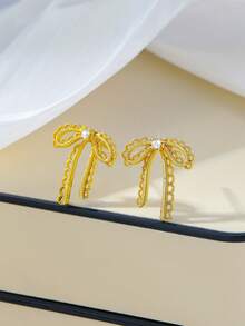 1对女士纹理蝴蝶结锆石铜耳钉，丝带设计，温柔优雅，适合早春、母亲节、日常及节日、音乐、派对等场合佩戴。 - 金黃色 - 查看 2