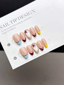 10片纯手工制作的按压式美甲贴片，短款杏仁形，复古简约风格。指甲以手绘裸色底色为底，搭配复古多色波点法式美甲图案，颜色包括酒红色、浅蓝色、黄色等，并点缀以玻璃珠猫眼效果。 - 彩色 - 查看 4