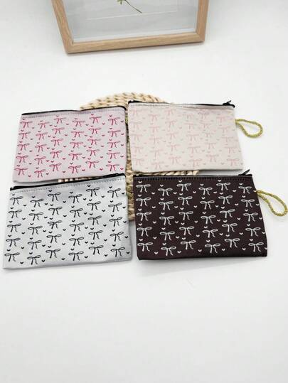1pc/4pcs New Women's Makeup Bag Features A Fashionable Bow Print. It Is A Hand-Held Storage Bag For Accessories And Jewelry, And A Coin Purse. It Is Suitable For Storing Digital Products, Bank Cards, Headphones, Hair Bands, Loose Change, Lipsticks, Cosmetics, And Comes With A Keychain. It Is Not Easy To Lose And Is A Perfect Gift For Girls