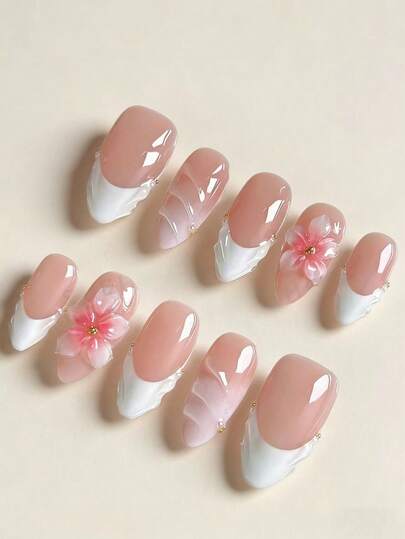 Uñas postizas elegantes de punta francesa en color rosa nude y blanco con forma de almendra, decoradas con flores 3D hechas a mano y perlas con acabado brillante, reutilizables. Diseño romántico para novia, ideal para uso diario, fiestas de boda, citas y estilo dulce de chica. Fácil de aplicar, de larga duración. Uñas postizas de calidad de salón de lujo para un aspecto sofisticado.