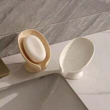 Khay đựng xà phòng tự thoát nước hình lá bằng nhựa, thích hợp cho bồn rửa mặt, vòi sen và nhà bếp. Khay có lỗ thoát nước giúp giữ xà phòng khô ráo và dễ dàng vệ sinh. - Nhiều màu - Xem 2