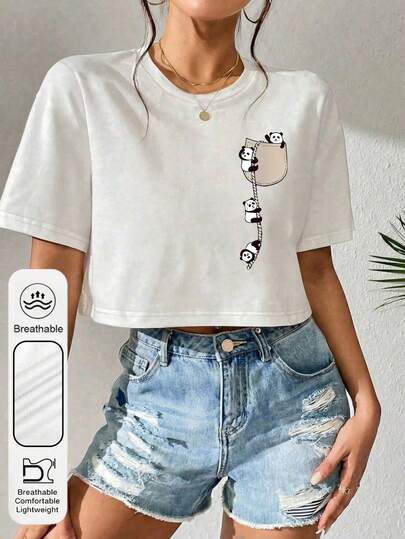 Parte superior casual de mujer de manga corta con cuello redondo y gráfico lindo de panda para uso diario. Camiseta blanca de mujer de moda y versátil con el ombligo expuesto. Adecuada para fiestas, playas, vacaciones, deportes, atuendos de graduación.