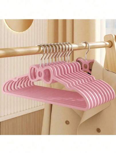 10 pièces Cintres en plastique roses en forme de nœud papillon mignons pour chambre à coucher, étagère de séchage créative pour dortoir d'étudiant, cintres pour vêtements antidérapants