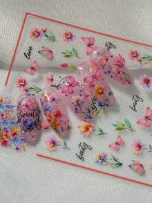水彩花卉蝴蝶美甲贴纸，以渐变粉橙色单瓣花、簇拥小花和蓝紫色小花为特色，并饰以英文文字，设计优雅艺术，适合春日约会、度假或日常精致装扮。 - 彩色 - 查看 4