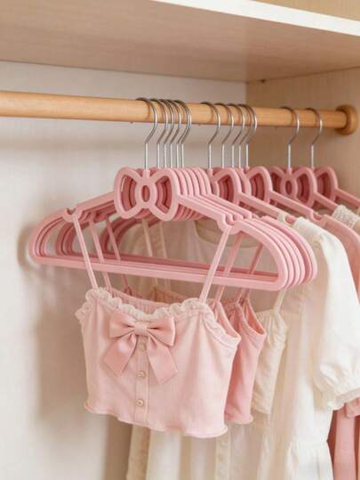 10pcs Pink Bowknot Plastic Hangers, Suitable For Home, Bedroom And Dorm. Cute Anti-Slip, Applicable For Wardrobe Organization, Wardrobe Decor, Home Decoration, Room Storage, Coat Storage, Short Sleeve Clothing Storage