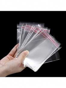 100 bolsas de embalaje de plástico OPP transparentes y autosellantes, adecuadas para empaquetar artículos como joyas, dulces - Ver 3