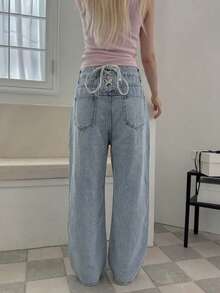 Quần jeans nữ ống đứng cạp cao thiết kế độc đáo với dây đeo khoét lỗ phía sau, thích hợp cho mùa hè. - Rửa nhẹ - Xem 3