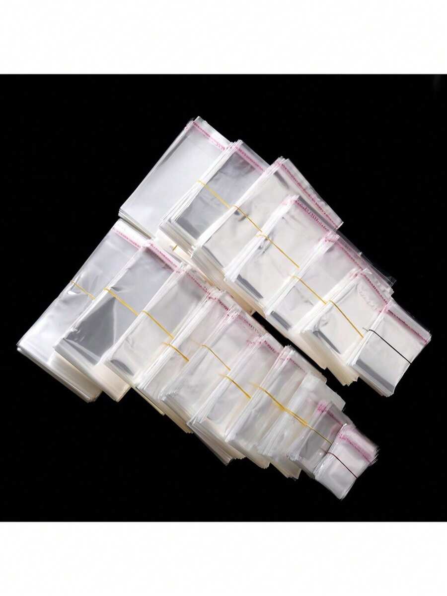 100 bolsas de embalaje de plástico OPP transparentes y autosellantes, adecuadas para empaquetar artículos como joyas, dulces - Ver 1