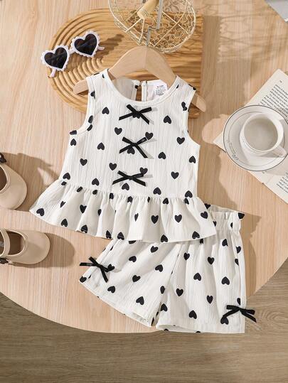 Bộ 2 món áo không tay mùa hè cho bé gái, áo vest in hình trái tim đính nơ + quần short cạp chun, dễ thương và thời trang, phù hợp cho bé sơ sinh, 0-1-2-3 tuổi, 6-9 tháng, thích hợp cho hoạt động ngoài trời, thường ngày, dự tiệc, quà tặng ngày lễ.
