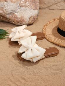 1 par de sandalias de playa para niñas de color beige, con un gran lazo y un diseño tejido, de material suave de PU con puntera redonda y suela plana, cómodas y tipo romano, adecuadas para niñas de 3 a 15 años para uso diario casual y vacaciones de verano, nuevo lanzamiento - Beis - Ver 3