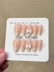 10片Y2K手工中号杏仁色乳白色渐变法式美甲贴纸，带蝴蝶结设计，加厚款，包含1瓶胶水和1个指甲锉，适合女士和女孩日常、派对和聚会使用。 - 彩色 - 查看 5
