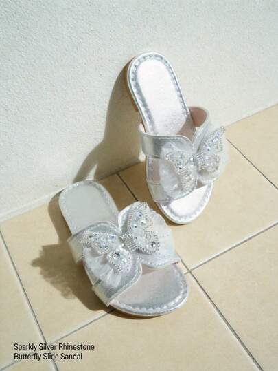 Bestseller Recommendation: Silver Butterfly Water Crystal Sandals For 3-12 Year Old Girls. Silver Metallic Luster PU Leather + Three-Dimensional Water Crystal Butterfly + Net Fabric Pleated. Open-Toe Slip-On Structure + Flat Rubber Sole. Dreamy And Ethereal Princess Style. Suitable For Birthday Parties, Vacation Travel Photoshoots, And Elegant Daily Wear. Spring/Summer Outerwear Sandals!