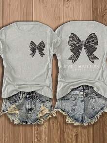 Nueva camiseta de moda para primavera y verano para niñas, estilo europeo y americano, cuello redondo, mangas cortas, ligera, transpirable, con estampado elegante, diseño cómodo, detalle de lazo, corte holgado, adecuada para uso diario y salidas, top deportivo casual versátil para uso urbano. - Negro - Ver 16