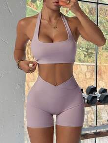 Bộ đồ thể thao nữ mùa hè màu trơn Aoqta Sports gồm hai mảnh: áo tank top không tay kiểu racerback có đệm ngực và quần short cạp chéo ôm bụng, phù hợp cho yoga, chạy bộ, tập luyện và mặc hàng ngày. - Màu tím - Xem 8