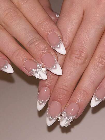 Medium-Sized Almond-Shaped Press-On Nail Tips, 24-Piece DIY Set. Features A Nude-Pink Base With Pure White French Tips, Pearl Trim, And 3D Heart And Bow Embellishments. These Gentle, Sweet, Princess-Style Nail Tips Are Perfect For Parties, Weddings, And Everyday Wear. They Are Removable And Reusable Press-On Nails.