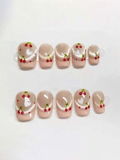 10片纯手工制作的按压式美甲，短款方形美甲，粉色系，春日少女风，裸粉色猫眼搭配粉色法式尖，手绘樱桃和爱心图案，可爱温柔的按压式美甲，适合女性和女孩，春夏秋冬节日派对及日常生活使用。