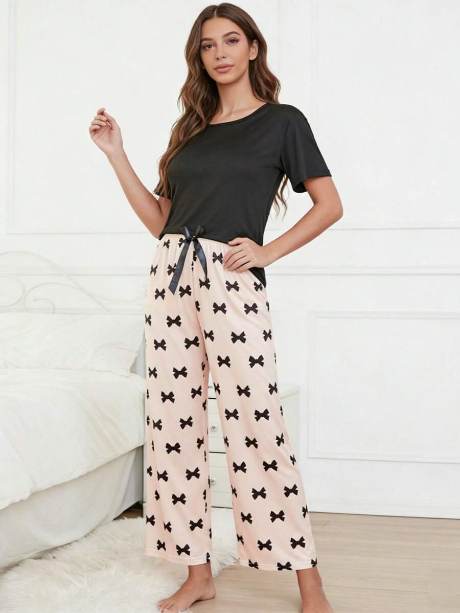2 piezas Conjunto de pijama de primavera/verano para mujer, camiseta negra con estampado de lazo y pantalones de estar por casa casuales - Rosa - Ver 1