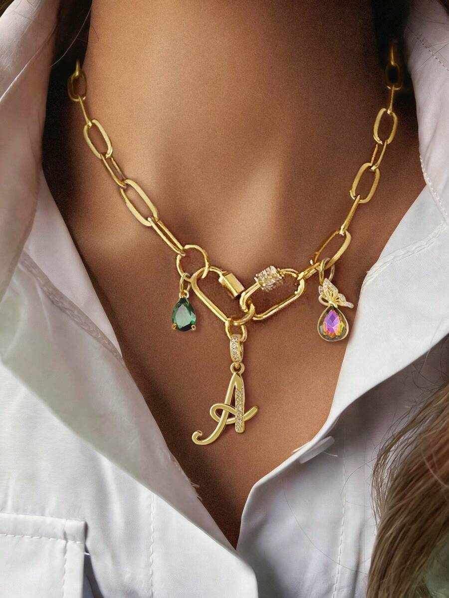 1 chiếc dây chuyền mặt dây chuyền nữ, bao gồm: Mặt dây chuyền thiết kế nghệ thuật 26 chữ cái, mặt dây chuyền hình giọt nước màu xanh lá cây, khóa cài hình bầu dục, khóa cài hình bầu dục đính đá, khóa cài đa năng đính đá và mặt dây chuyền hình bướm giọt nước. Thanh lịch, thời trang và đa năng, thể hiện cá tính riêng, phù hợp để đeo hàng ngày. - Vàng - Xem 1