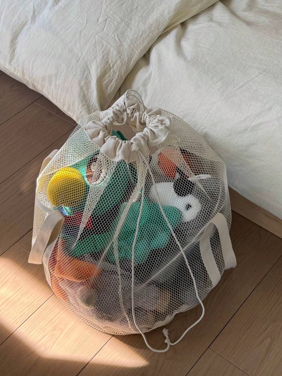 1 chiếc túi lưới rỗng, dung tích lớn, có dây rút, dùng để đựng đồ chơi/khối xếp hình. - Màu be - Xem 1