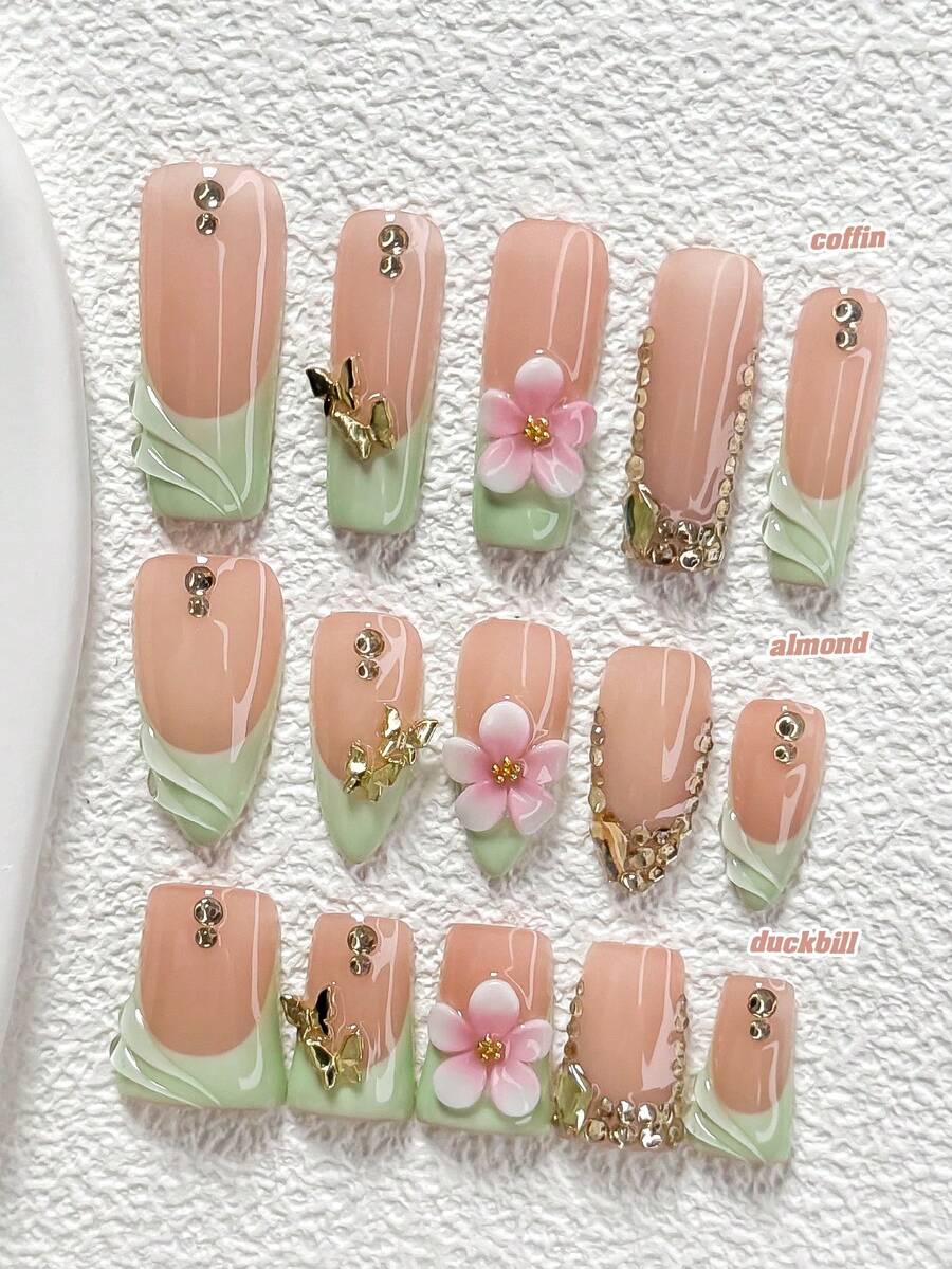 10件套甜美优雅手工美甲套装,包含凝胶指甲油、蝴蝶箭头钻石美甲配件、手工五瓣花美甲装饰、绿色指甲油,适合春夏派对、日常佩戴、拍照、通勤等场合,提供杏仁形、鸭嘴形、棺材形三种形状的美甲贴片。 - 彩色 - 查看 1