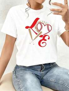 The Print Features A Heart With A Baseball Texture, Embraced By A Glove And Two Crossed Bats, Symbolizing The Love Of The Sport, Passion, And Team Unity. Women's T-Shirt, 100% Cotton, Comfortable For Everyday Wear, Modern And Soft - 白色的 - 查看 1