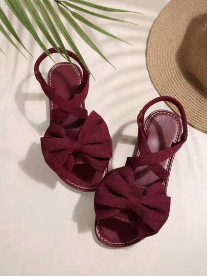 Sandalias planas cómodas y sencillas con puntera redonda para mujer de talla grande, con elástico cruzado y decoración de lazo, de moda casual para exteriores, playa y verano