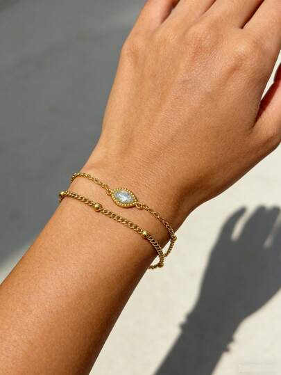 1条18K镀金不锈钢双层链手链，配锆石眼睛吊坠，休闲百搭时尚配饰，适合日常佩戴，也是送给姐妹、母亲、女友的节日和生日礼物。