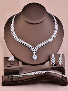 CORUIXI Juego de joyería de 4 piezas de lujo y elegante con zirconia cúbica en forma de lágrima para mujer, que incluye collar, aretes, pulsera y anillo. Collar de gargantilla de cristal y diamante brillante de plata adecuado para novia, dama de honor o regalo de cumpleaños. - Plateado - Ver 8