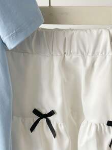 Bộ đồ mùa hè thường ngày cho bé gái: áo hai dây màu xanh trơn có nơ và chân váy ngắn màu trắng. - Màu xanh nhạt - Xem 6