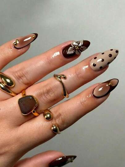 Biến đổi bộ móng của bạn với bộ 24 móng giả kiểu Pháp dáng hạnh nhân, độ dài trung bình, màu nâu gradient độc đáo, họa tiết hoa 3D chấm bi và hạt vàng trang trí, phủ toàn bộ móng - Hoàn hảo cho phụ nữ và các cô gái dự tiệc, hẹn hò, kỳ nghỉ và diện trong mùa thu/đông.