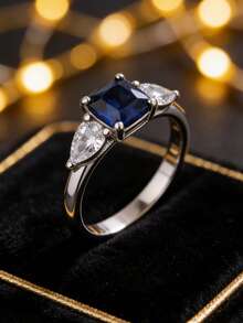 1 chiếc nhẫn bạc 925 mạ bạch kim sang trọng đính đá Zirconia xanh dương, điểm nhấn kim cương hình giọt nước ở hai bên, món quà cao cấp thanh lịch dành cho người yêu. - Nhiều màu - Xem 5