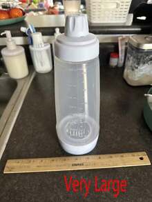 1件防傾倒煎餅麵糊分配器附攪拌球，適用於杯子蛋糕、馬芬和煎餅，刻度廚房工具，家用物品，食用油瓶，手搖麵糊攪拌瓶，奶油攪拌分配器，廚房食用油分配器，廚房配件，廚房用品，廚房裝飾，家居配件，廚房收納用品，露營必需品，節日必需品 - 彩色 - 查看 3