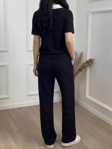 Bộ đồ nữ mới gồm áo polo tay ngắn và quần ống rộng cạp chun, thích hợp cho mùa xuân/hè. Áo polo phối màu tương phản kết hợp với quần ống rộng, phù hợp cho các hoạt động thể thao ngoài trời, tập thể dục, đi làm, thời trang đường phố. Màu đen thanh lịch. - màu đen - Xem 6