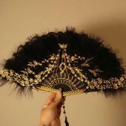 Oriental Ink Art Folding Fan – Tassel Decor Traditional Hand Fan. Charming Ink Patterns (Lotus, Flowers): Perfect For Traditional Style Lovers; Foldable Design + Tassel: Easy To Carry. Durable Build: Suitable For Cooling, Photo Props. Great For Gifts, Home Decor. Elegant Chinese Folding Fan!