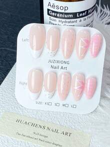 Bộ 10 miếng dán móng tay thủ công màu hồng nude và trắng kiểu Pháp (XS/S/M/L): Nền hồng nude với đầu móng trắng kiểu Pháp, trang trí bằng đá lấp lánh, chấm bi hồng và hoa trái tim màu hồng, phong cách tươi tắn và ngọt ngào, bề mặt bóng mịn, phù hợp cho các hoạt động hàng ngày, hẹn hò lãng mạn, có thể tái sử dụng. - Hồng - Xem 13