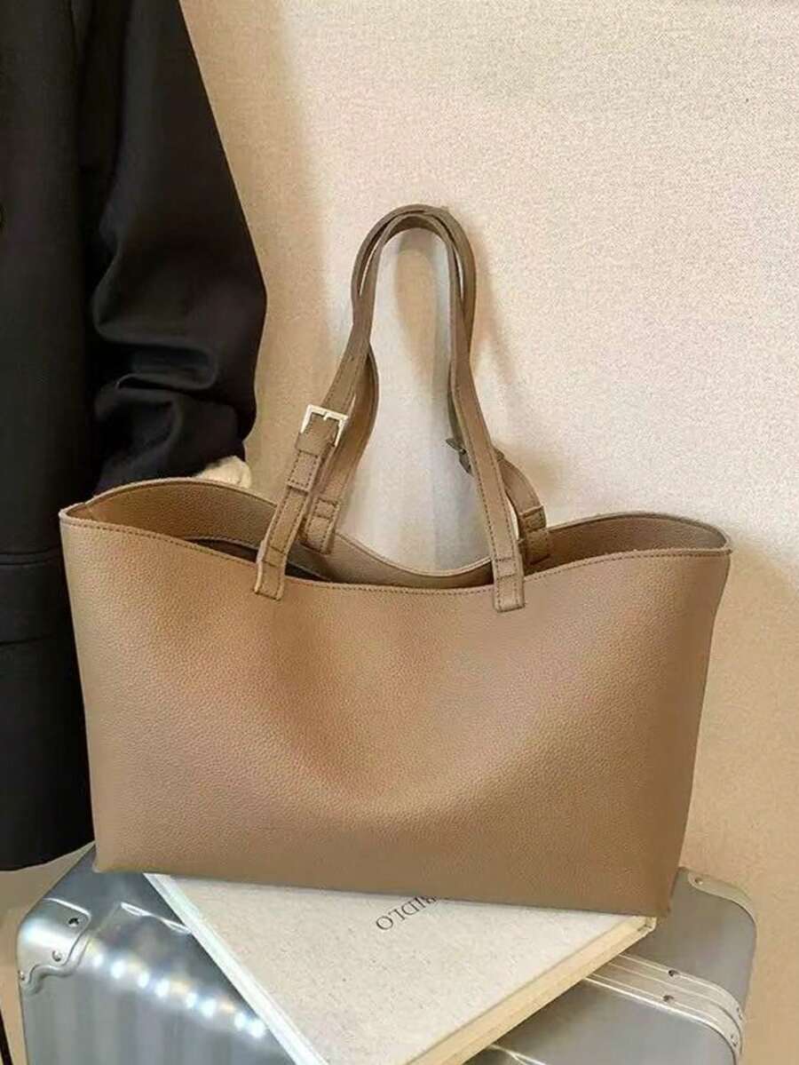 1个大容量休闲通勤手提包，设计优雅，品质优良，简约百搭，可调节肩带