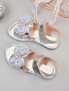 Sandal trẻ em kiểu công chúa ngọt ngào, đính đá lấp lấp lánh, đế mềm PU bóng, kiểu dáng hoạt hình nơ, năm 2026, thích hợp cho các hoạt động ngoài trời mùa hè/du lịch biển. - Bạc - Xem 4