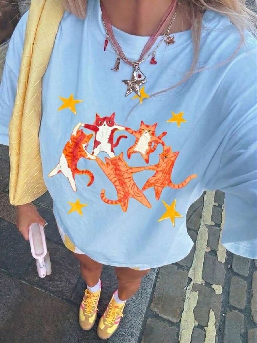 2000年代风格新款夏季男女通用复古T恤,饰有跳舞猫和星星图案,宽松舒适,适合夏季休闲穿着。 - 淺藍色 - 查看 1