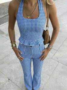 Bộ đồ đi biển mùa xuân/hè kiểu retro kẻ caro xanh trắng gồm áo hai dây hở lưng và quần dài dệt kim cài cúc, phong cách nghỉ dưỡng bãi biển, phù hợp cho nữ dáng người nhỏ nhắn. - Xanh và trắng - Xem 1