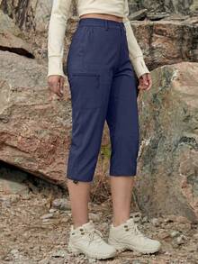 Cavva Pantalones capri resistentes al agua para mujer, transpirables, de secado rápido y ligeros, con una entrehierro de 19 pulgadas, cintura media, laterales elásticos, bajo ajustable, 5 bolsillos seguros, ideales para senderismo, acampada y uso casual - Azul Marino - Ver 3